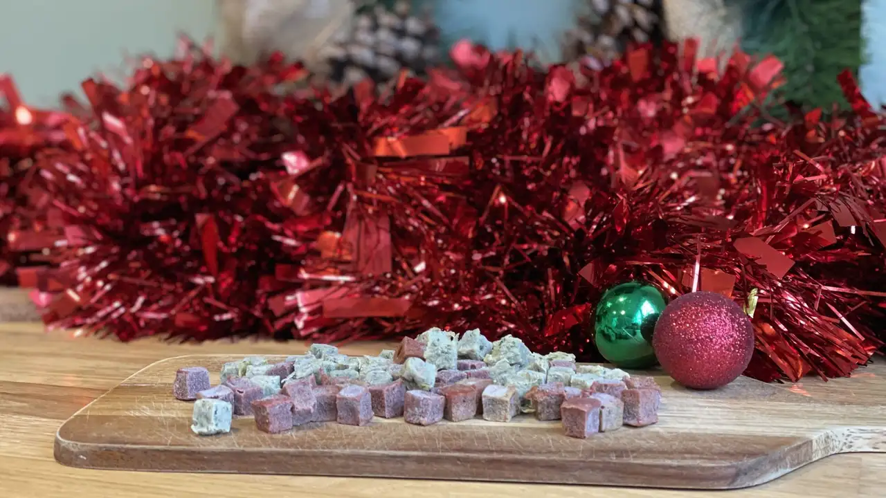 Close up on a plate of mashed potatoes, topped with baked pork chops with cream of mushroom soup, and a side of green beans.